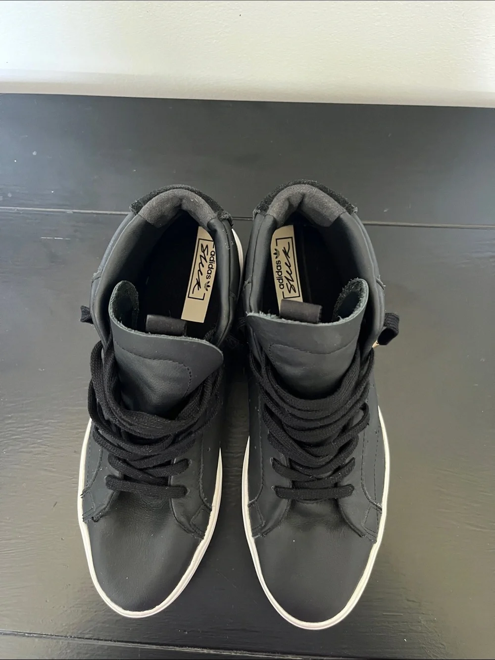 Adidas W/7.5 Black High-Top Sneakers/ white sole and gold logo.